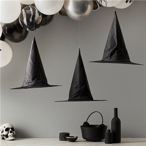 black witches hanging hats